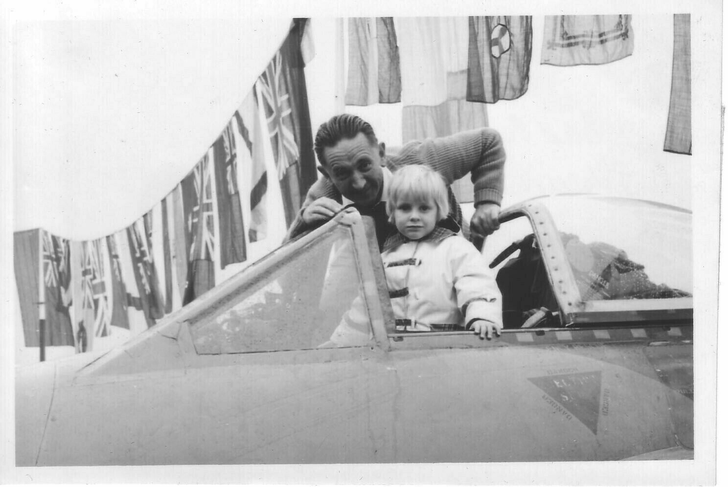 3 year old Alex sat in an English Electric Lightning fighter jet, with my dad looking on